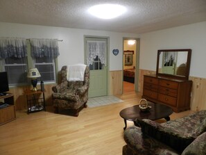 TV, fireplace, books - The Grey Cabin at Highland Hideaways (mouth of wilson)
