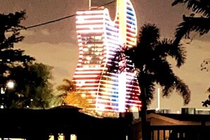 A brightly lit building with a unique, striped facade. - Private Guest suite with a beautiful view of the new hard rock hotel and casino (Fort Lauderdale)
