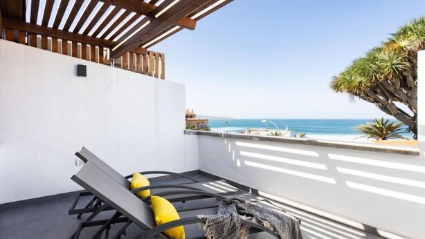 A sun lounger with a view of the sea.