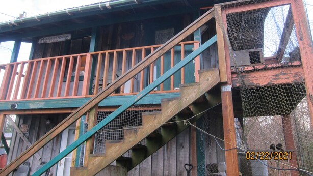 A wooden building with a balcony and a staircase. - Downtown Craig (Craig)