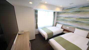 A hotel room with two beds, a desk with a telephone, and a large abstract painting on the wall.