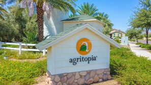 A small white building with a green roof and a sign that reads "agritopia". - Holiday Inn Express & Suites Gilbert Mesa Gateway Airport by IHG (Gilbert)