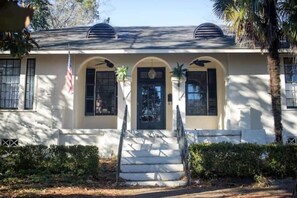 A two-story house with a front porch, steps, and a flag. - Mins to ASU & Downtown- Foxy on Felder (Montgomery)