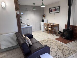 Cottage | Living area | 30-inch TV with digital channels, fireplace - Poachers Hut 1-bed Cottage, Sleeps 2, Pet Friendly (Newport)