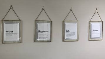 Four framed quotes on a wall.
