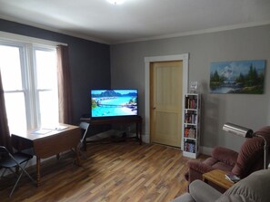 Smart TV, DVD player, foosball, books