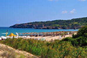 On the beach, sun loungers