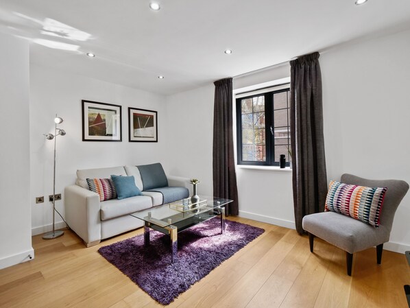 Apartment, 3 Bedrooms | Living area | Flat-screen TV