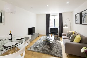 Apartment, 2 Bedrooms | Living area | Flat-screen TV