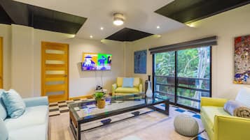 Superior Apartment | Living area | 40-inch Smart TV with digital channels, streaming services