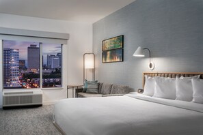 Premium bedding, desk, laptop workspace, iron/ironing board