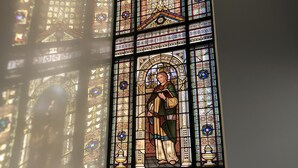 A stained glass window with intricate designs and a central figure. - East Church House (Strathaven)