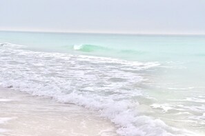 On the beach, sun loungers, beach towels