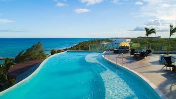 2 outdoor pools, open 7:00 AM to 6:00 PM, pool umbrellas, pool loungers