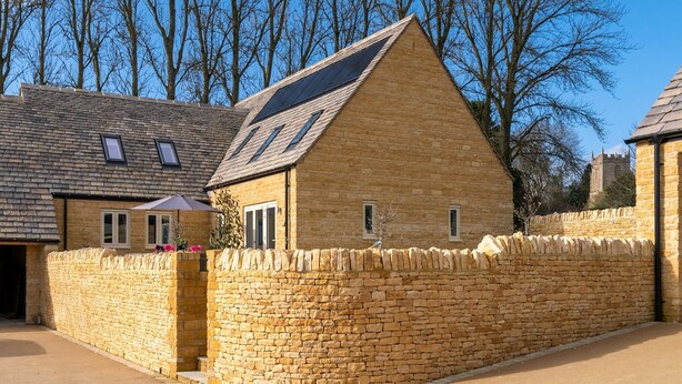 A stone building with a sloped roof and solar panels. - Maple House - sleeps 9 guests  in 5 bedrooms (Ebrington)