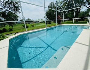 A heated pool, pool loungers