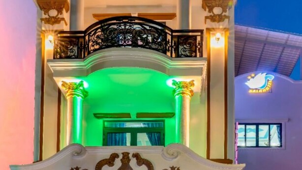 A hotel entrance with a balcony, columns, and a sign reading "SALAHOTEL". - Sala Hotel (Ho Chi Minh City)