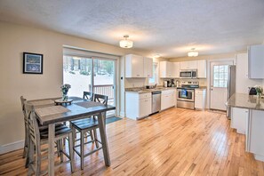 Enjoy cooking in this well-equipped kitchen with a central island, microwave, oven, and dishwasher.
