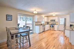 Enjoy cooking in this well-equipped kitchen with a central island, microwave, oven, and dishwasher.
