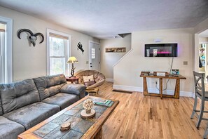 Relax in style with a comfortable sofa, coffee table, and dining area, perfect for unwinding and entertaining.