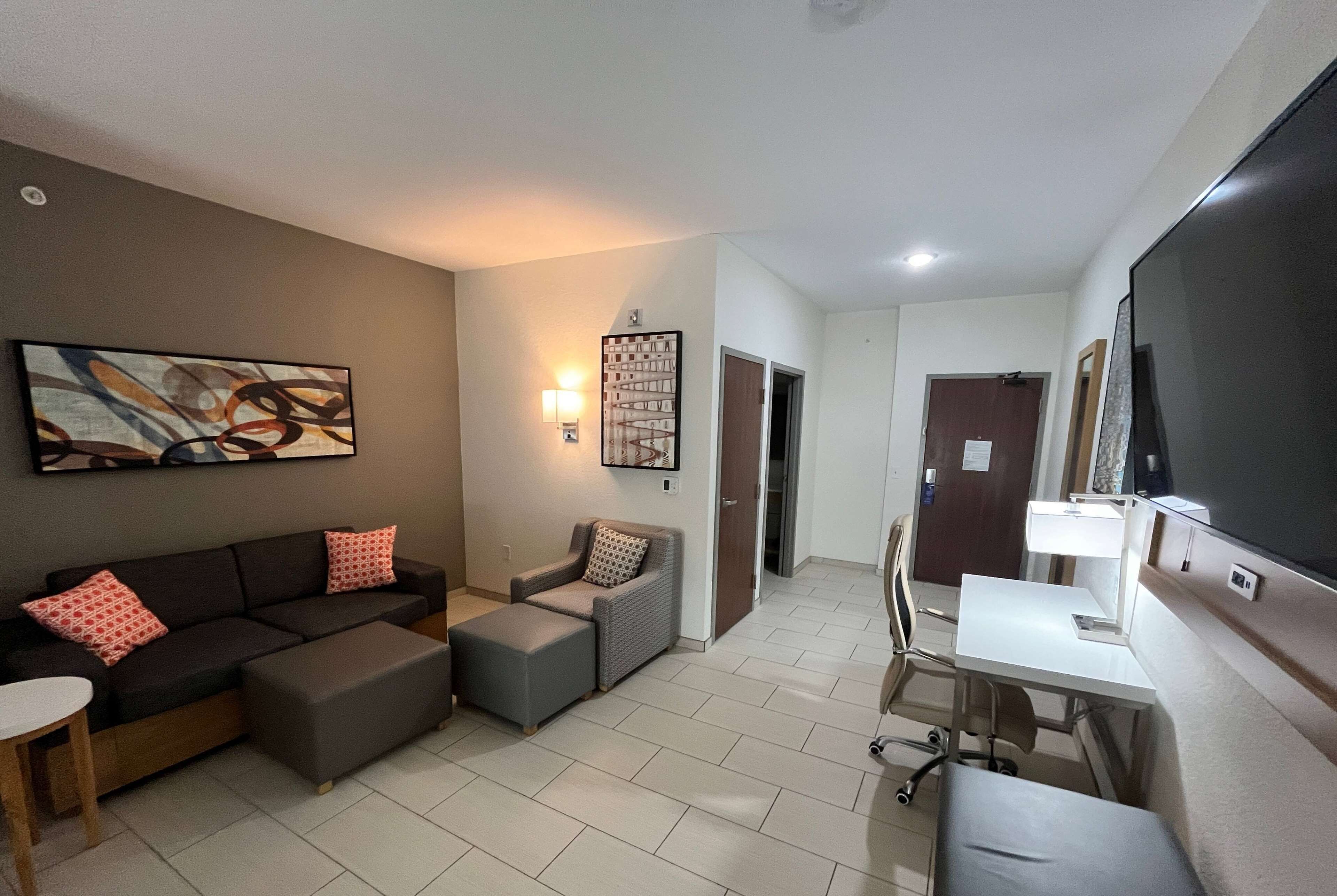 suite, multiple beds, kitchenette (2 tvs) | desk, laptop workspace, iron/ironing board, bed sheets