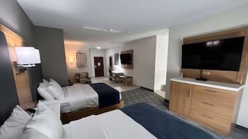 Suite, Multiple Beds, Kitchenette (2 TVs) | Desk, laptop workspace, iron/ironing board, bed sheets