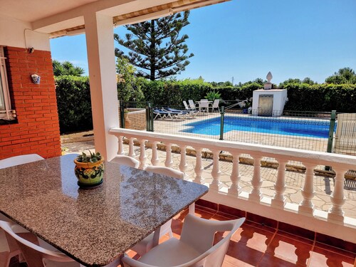 Cozy little house with private pool and security fence for children.
