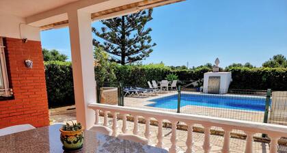 Cozy little house with private pool and security fence for children.
