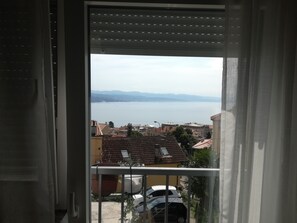 Enjoy the serene view of the water and town from your balcony.