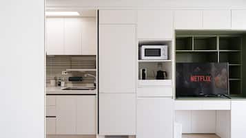 Fridge, microwave, coffee/tea maker, cookware/dishes/utensils