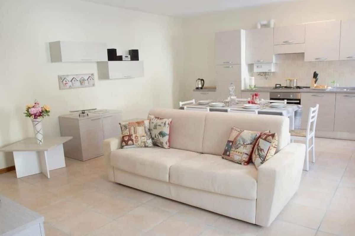 Basic Apartment (Piana 8) | Living area | Flat-screen TV