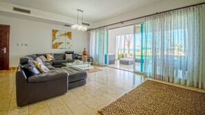 Exclusive Condo, Pool View, Beachfront | Living area - Blue Green E3C1 (Sosúa)