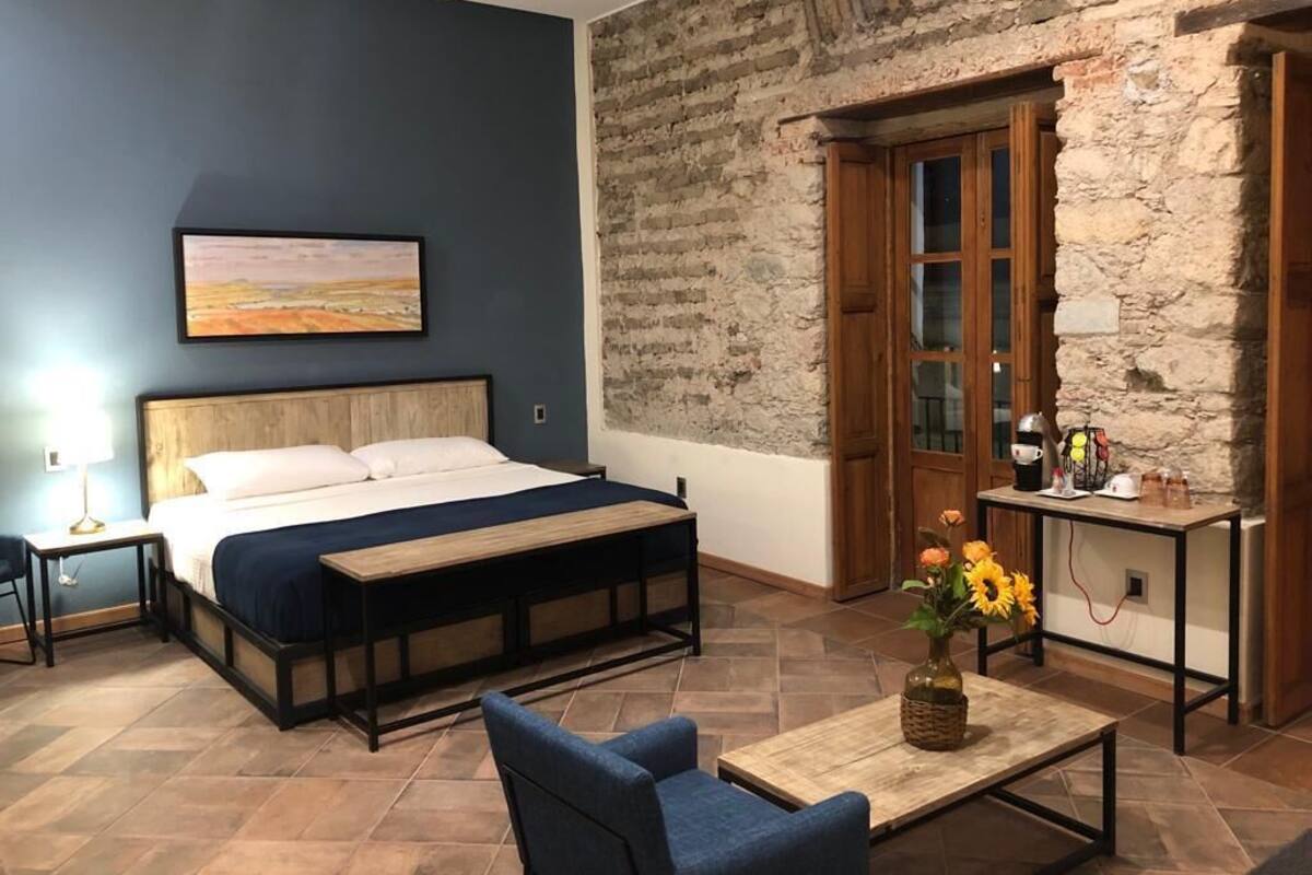 Executive Suite | Desk, laptop workspace, iron/ironing board (on request), free WiFi
