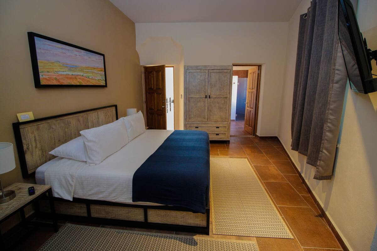Executive Suite, 1 King Bed | Desk, laptop workspace, iron/ironing board (on request), free WiFi