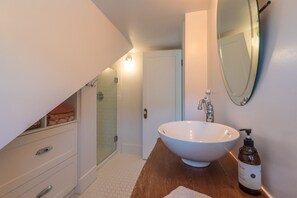 Bathtub, hair dryer, towels, soap