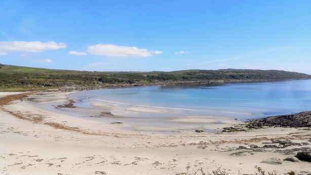 A coastal landscape with a sandy beach, calm water, and rolling hills in the background. - 2 bedroom accommodation in Tayvallich (Tayvallich)