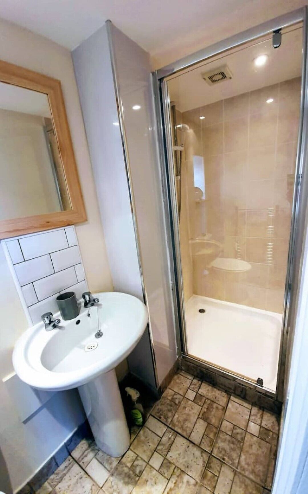 Shower, hair dryer, towels, toilet paper