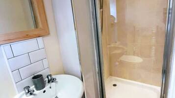 Shower, hair dryer, towels, toilet paper