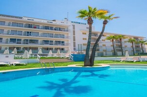 Outdoor pool, open 10:00 AM to 7:00 PM, pool umbrellas, pool loungers