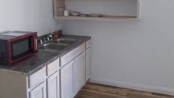 Fridge, microwave, coffee/tea maker, dining tables