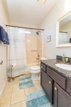 Combined shower/tub, hair dryer, towels, soap