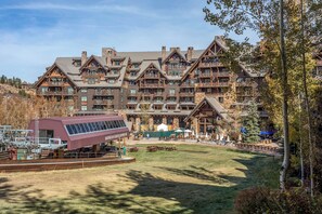 A large lodge with multiple balconies and a ski lift in the foreground. - 4BR ski-in/out Beaver Creek condo with mountain views (Avon)