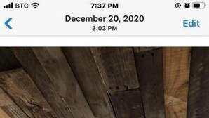 A room with a sloped ceiling made of wooden planks, a window, and a door. - Completely Remodeled-- 1/1 just 2 blocks from the base! (Angel Fire)