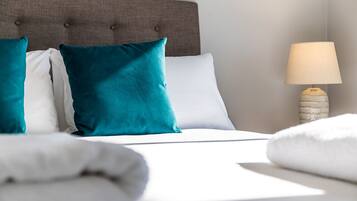 4 bedrooms, premium bedding, desk, laptop workspace