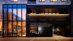 A modern hotel entrance with large glass windows, a staircase, and a welcoming sign. - Bespoke Hotel Sapporo (Sapporo)