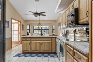 Fridge, microwave, oven, stovetop - Blue Haven Large Waterfront Pool Home | Boat Dock | Canal | Water Views | Pool Bar | WIFI | Fishing (Palm Coast)