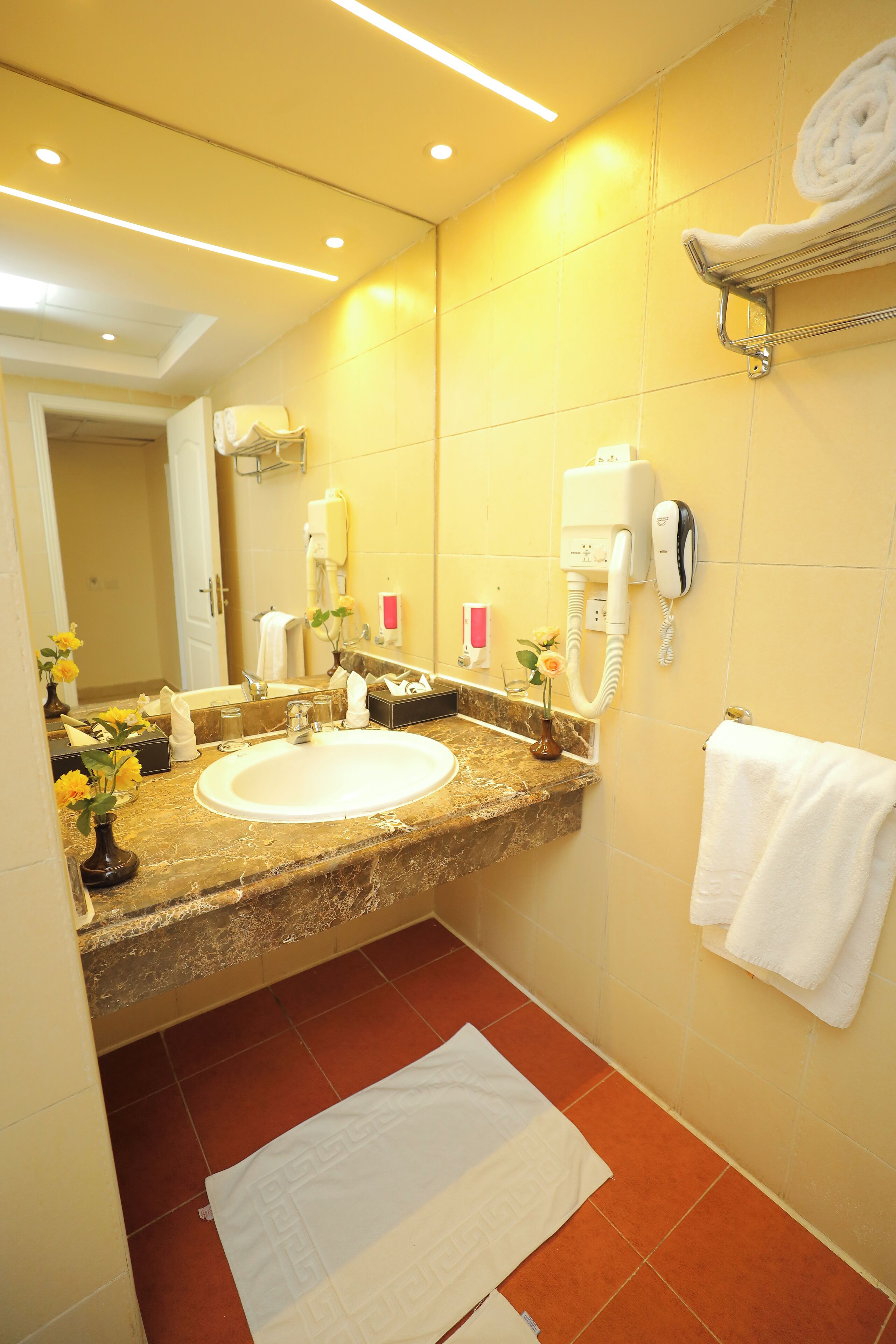 Bathtub, hair dryer, towels