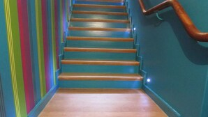 A staircase with wooden steps and a handrail, leading upwards. - Luxurious Countryside Holiday Home With Garden (Malmedy)