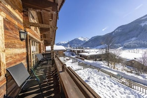 A wooden building with a balcony overlooking a snowy landscape and mountains. - Restful Chalet in Wald-Königsleiten near Ski Bus (Wald im Pinzgau)