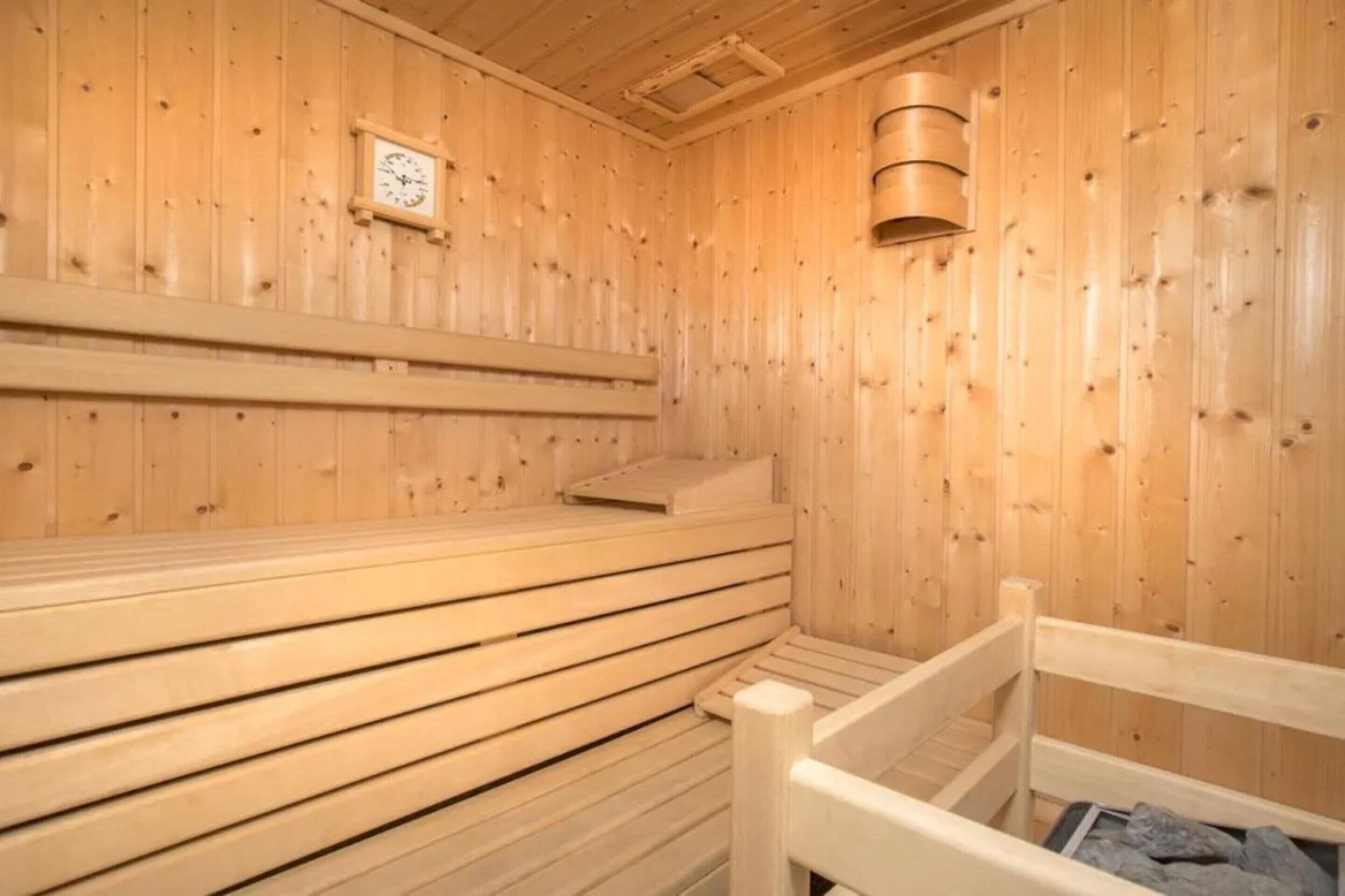 A sauna with wooden walls and benches.